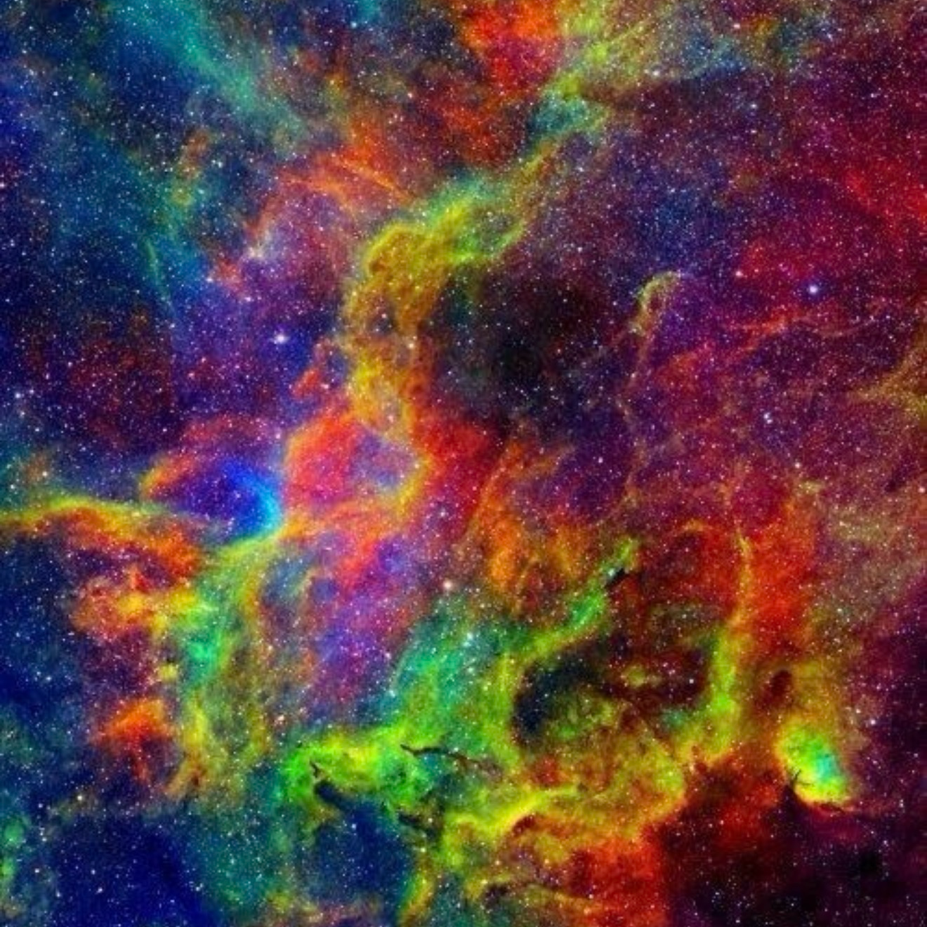 Colorful nebula with vibrant hues of red, green, and blue in space.