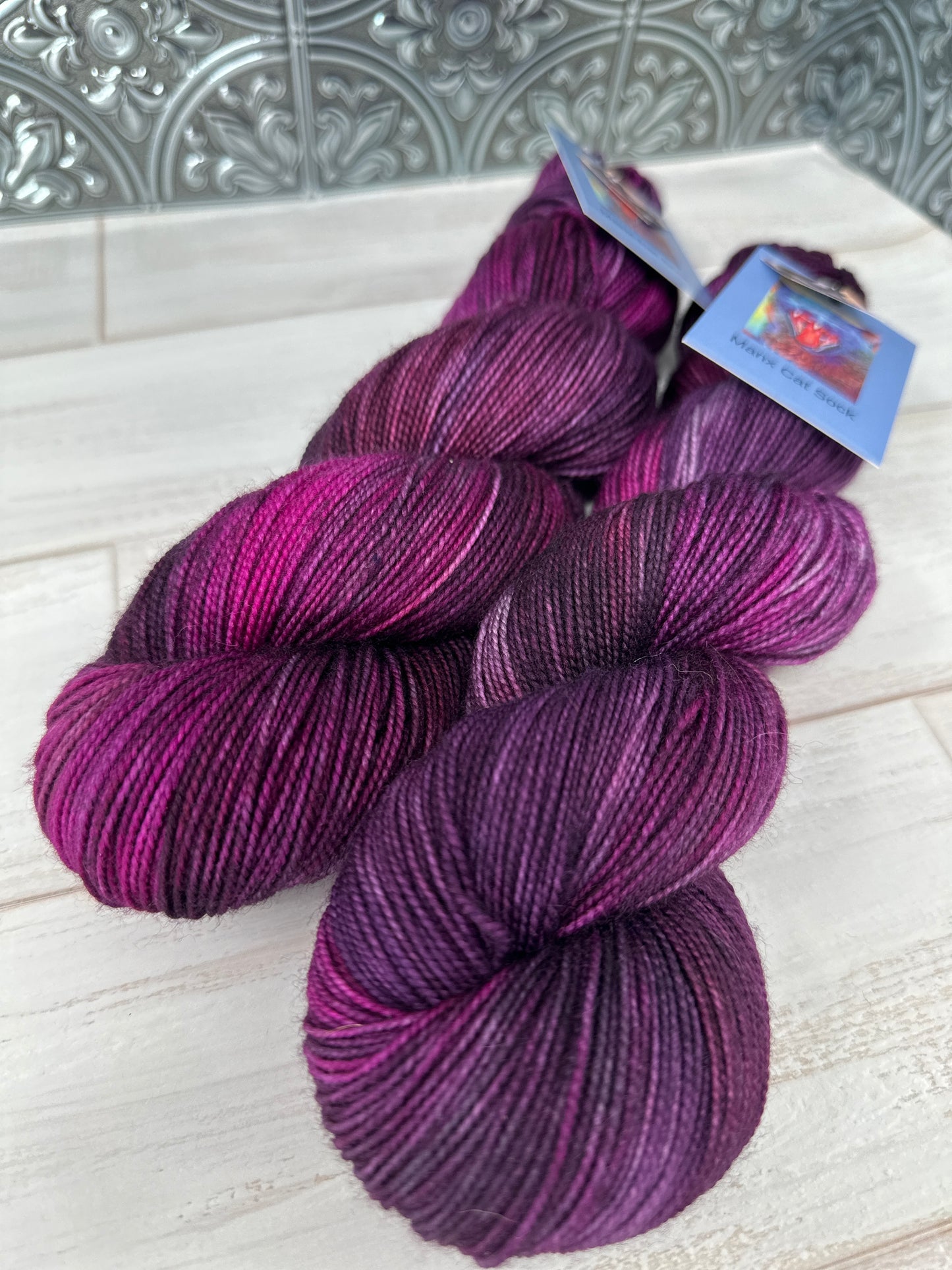 "Eggplant" on Various Yarn Bases