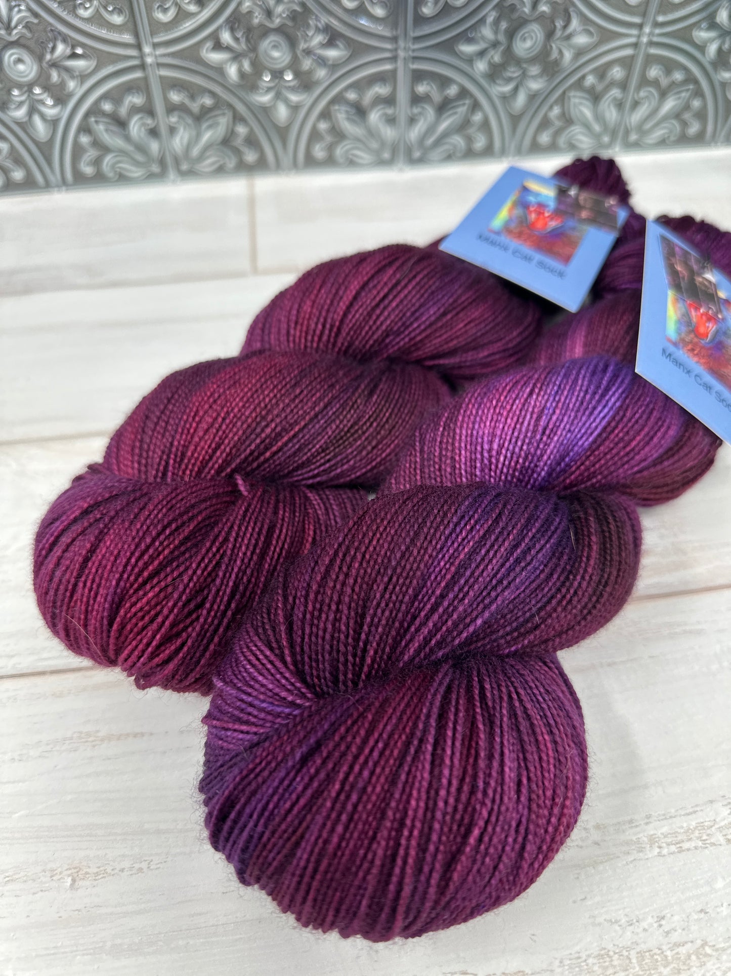 "Violet Bordello" on Various Yarn Bases