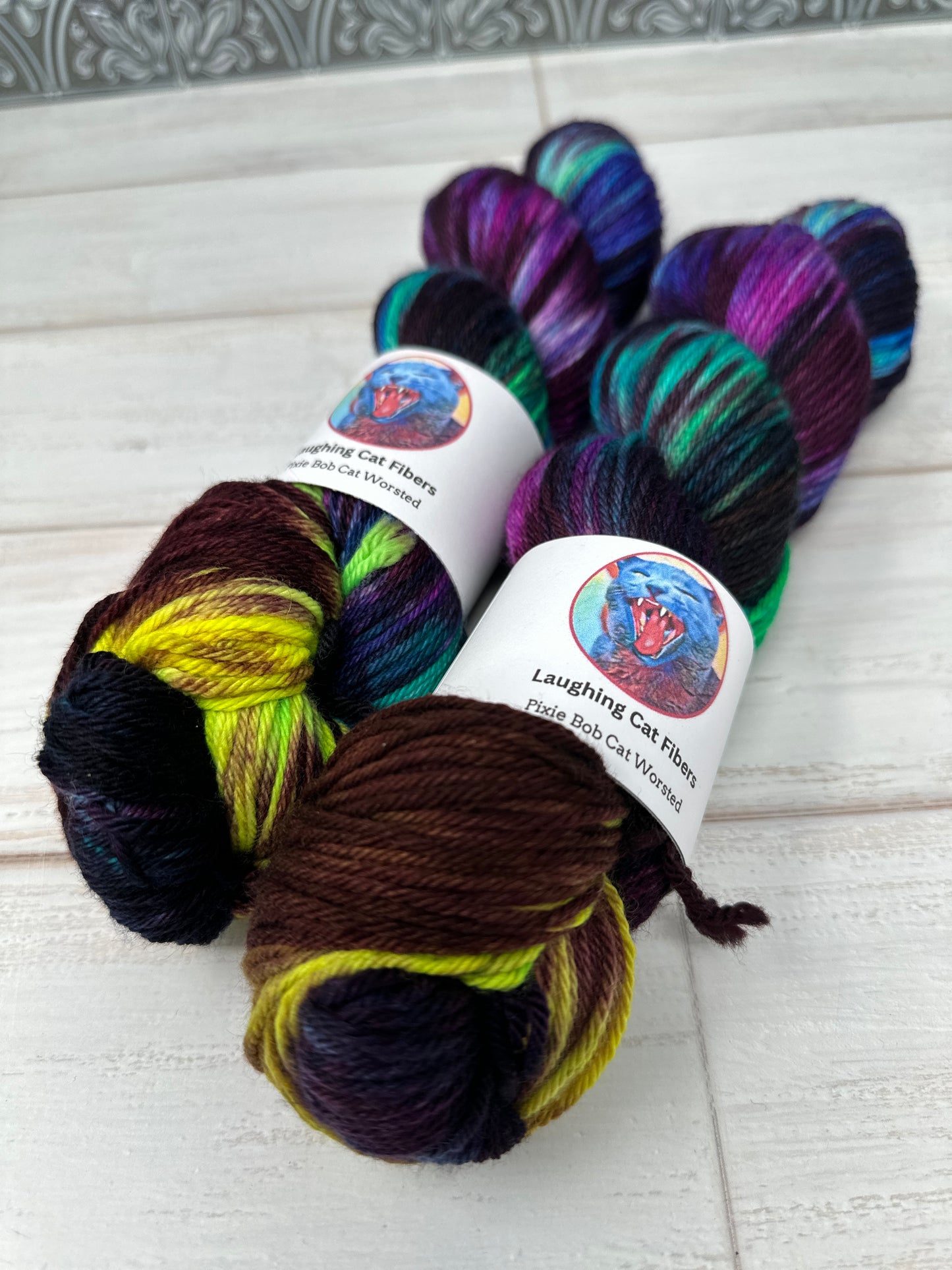 "A Swiftly Tilting Planet" on Various Yarn Bases