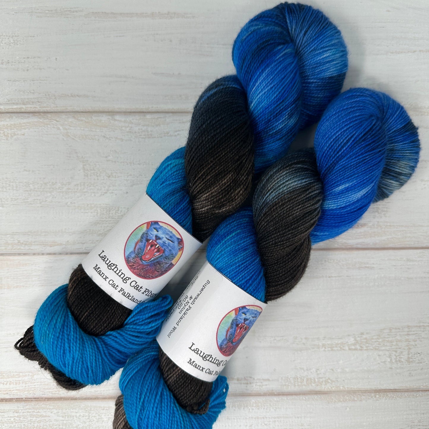 Blue and black hand dyed Manx Cat Falkland sock yarn by Laughing Cat Fibers in their colorway The Bluest Eye