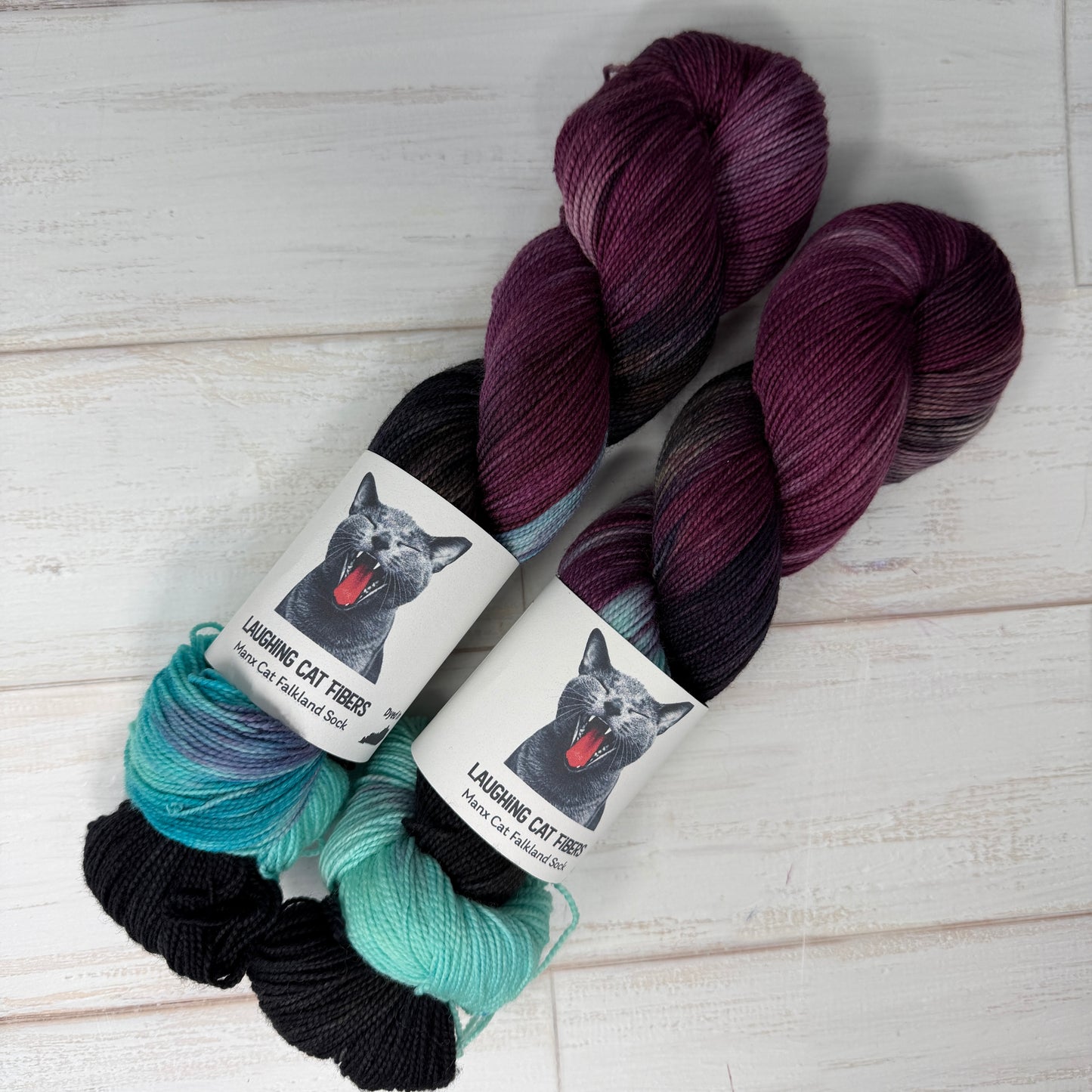 Three skeins of Manx Cat Falkland sock yarn dyed in the To Kill a Mockingbird colorway 