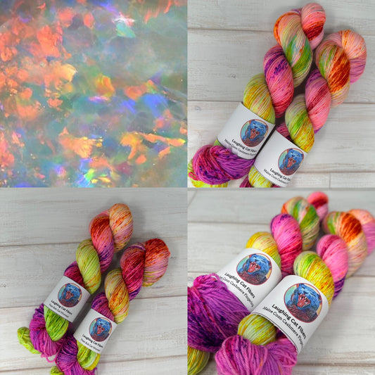 Multicolored yarn skeins with labels on a wooden surface