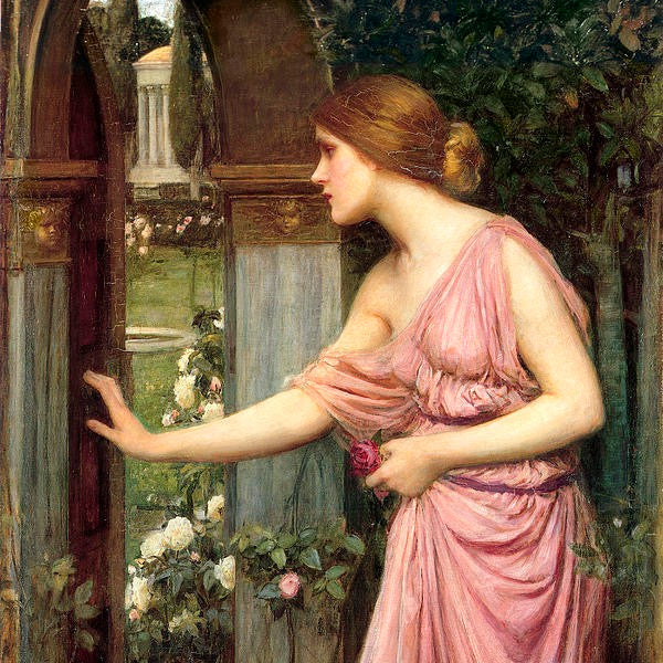 Woman in a pink dress standing in a garden with flowers and architectural elements.