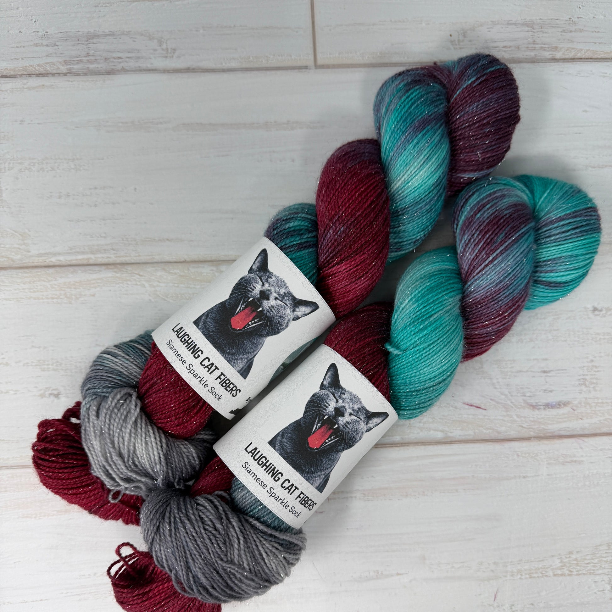 Multicolored yarn skeins with 'La Bièvre' labels on a light wooden surface