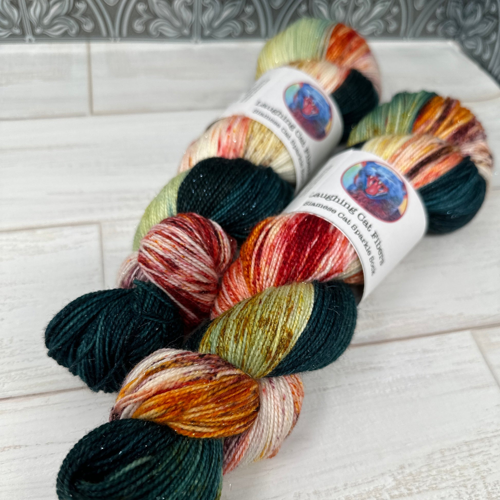 two skeins of sparkle sock in the summer colorway by Laughing Cat Fibers