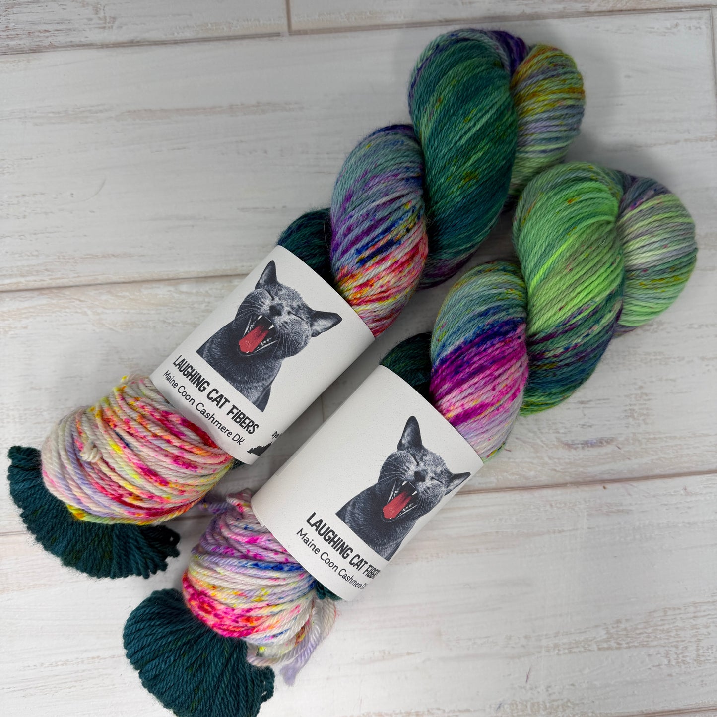 two skeins of MCN DK hand dyed yarn by Laughing Cat Fibers in their Ophelia colorway 