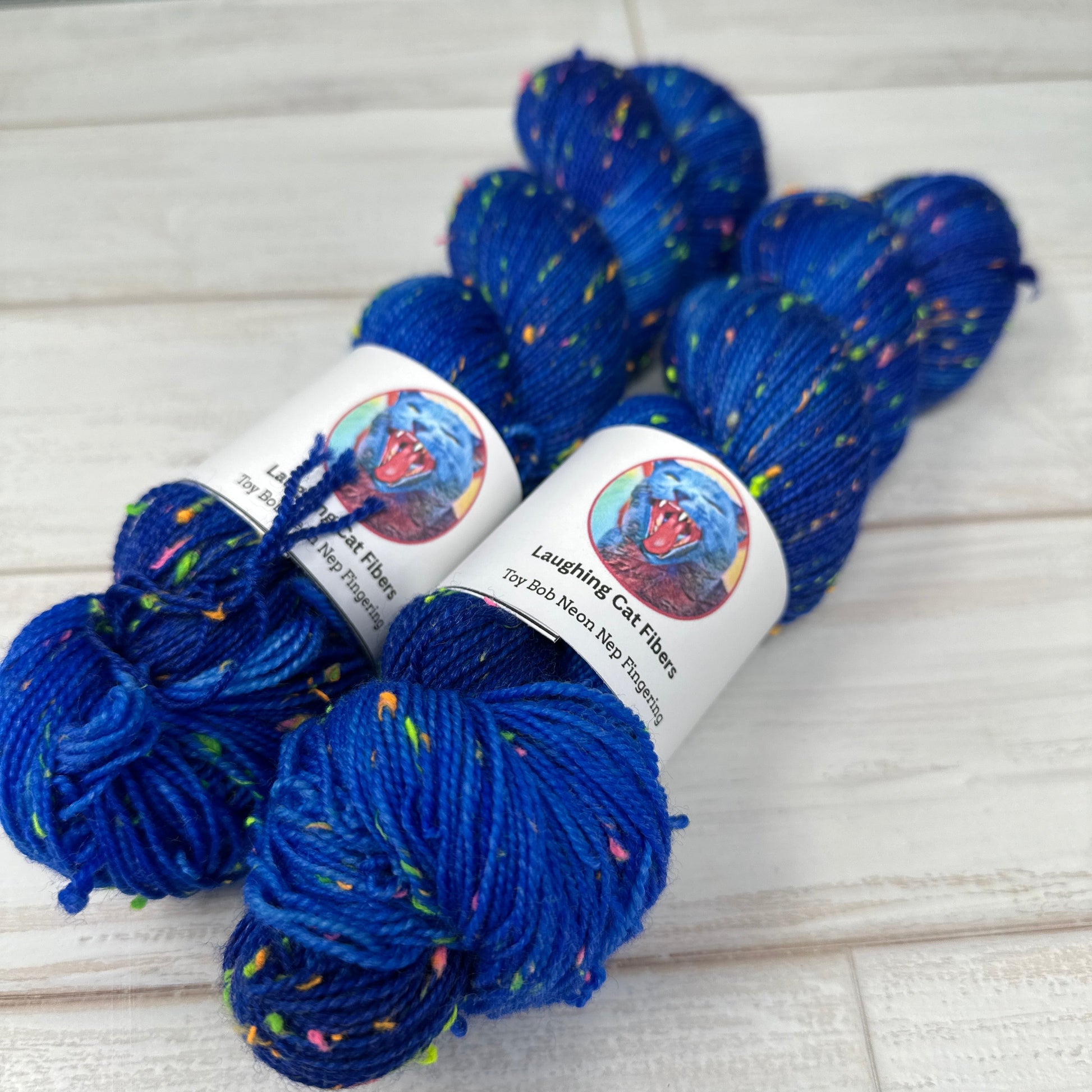 “Deep midnight blue hand dyed yarn with neon Donegal neps on Neon Nep Sock base.”