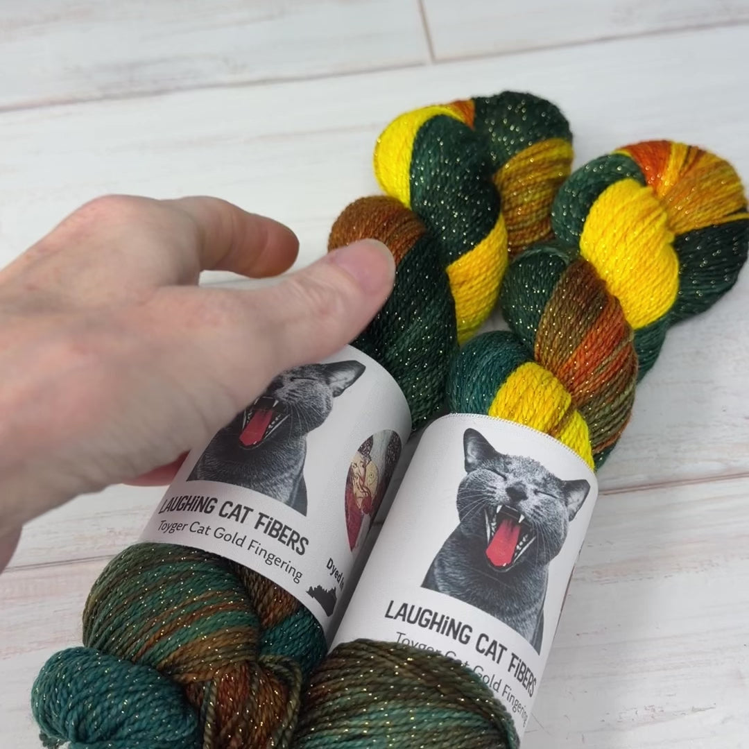 video clip of Laughing Cat Fibers gold lurex yarn in Goldfish colorway 