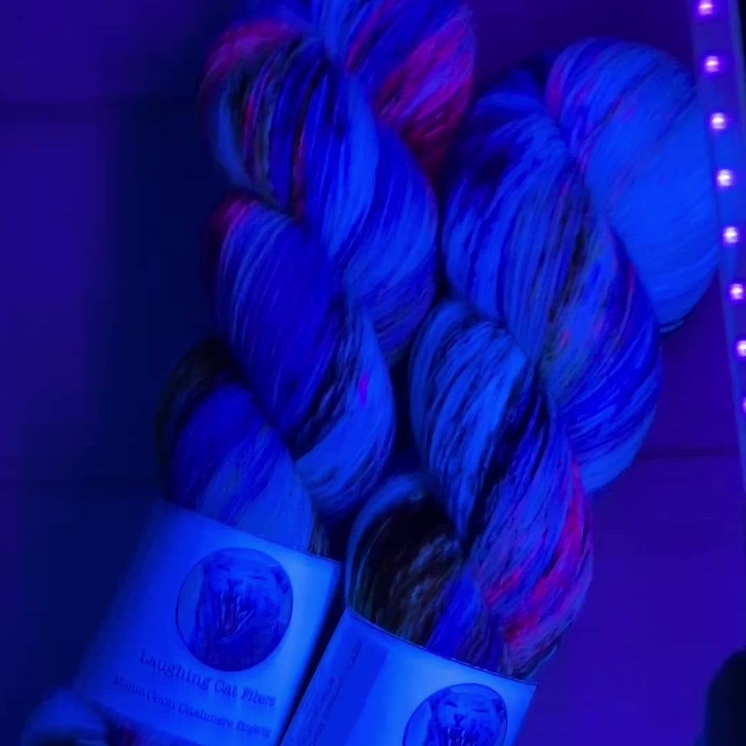 UV video show and tell of hand dyed yarn by Laughing Cat Fibers in their Jupiter Colorway 