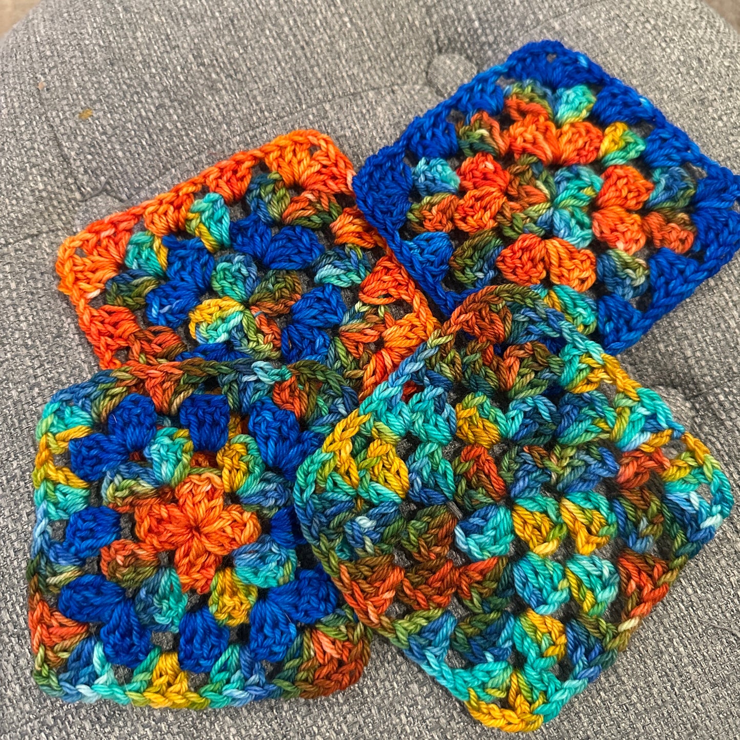 crochet granny squares in the Laughing Cat Fibers colorway Their Eyes Were Watching God and the matching tonal 
