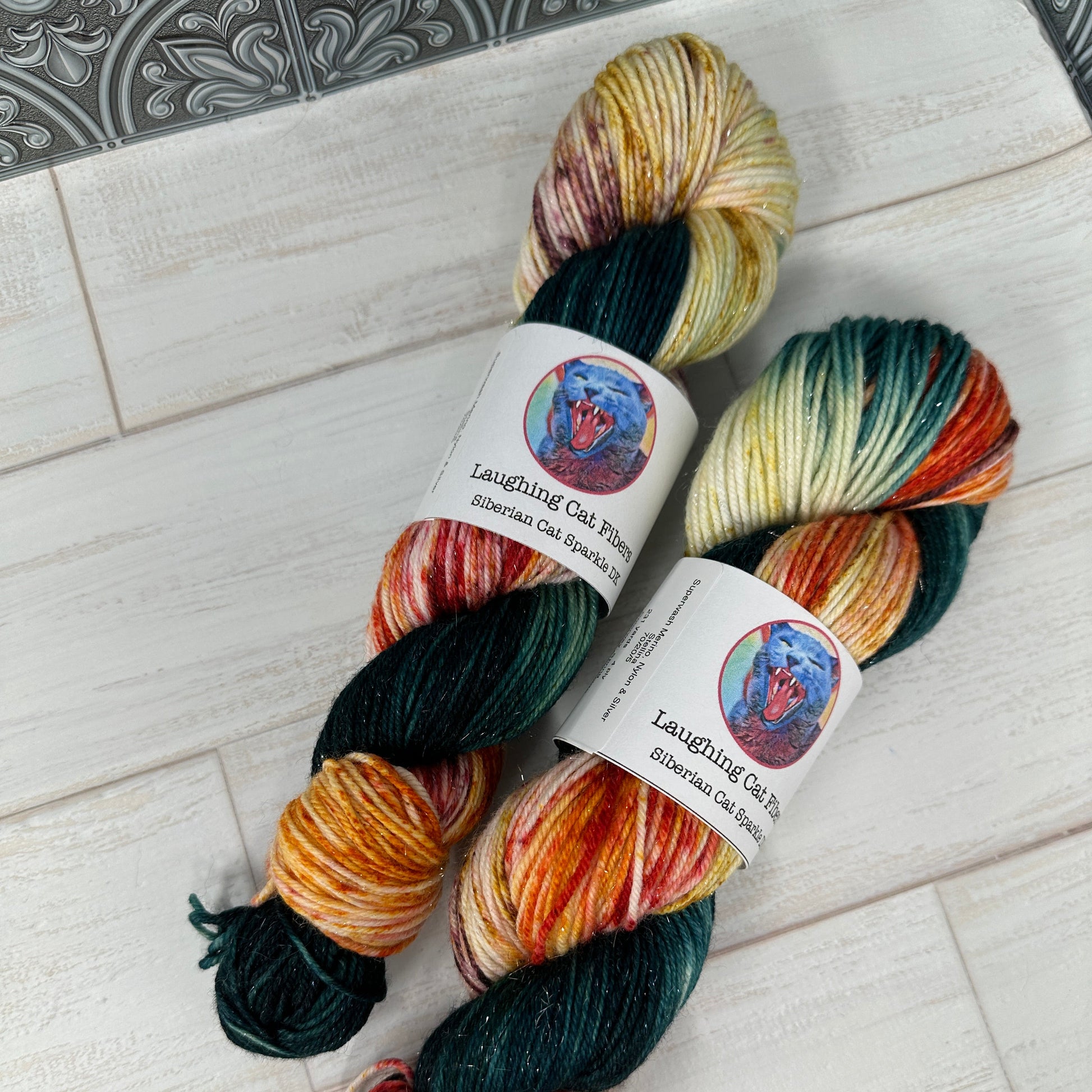 two skeins of hand dyed yarn by Laughing Cat Fibers in their Spring colorway