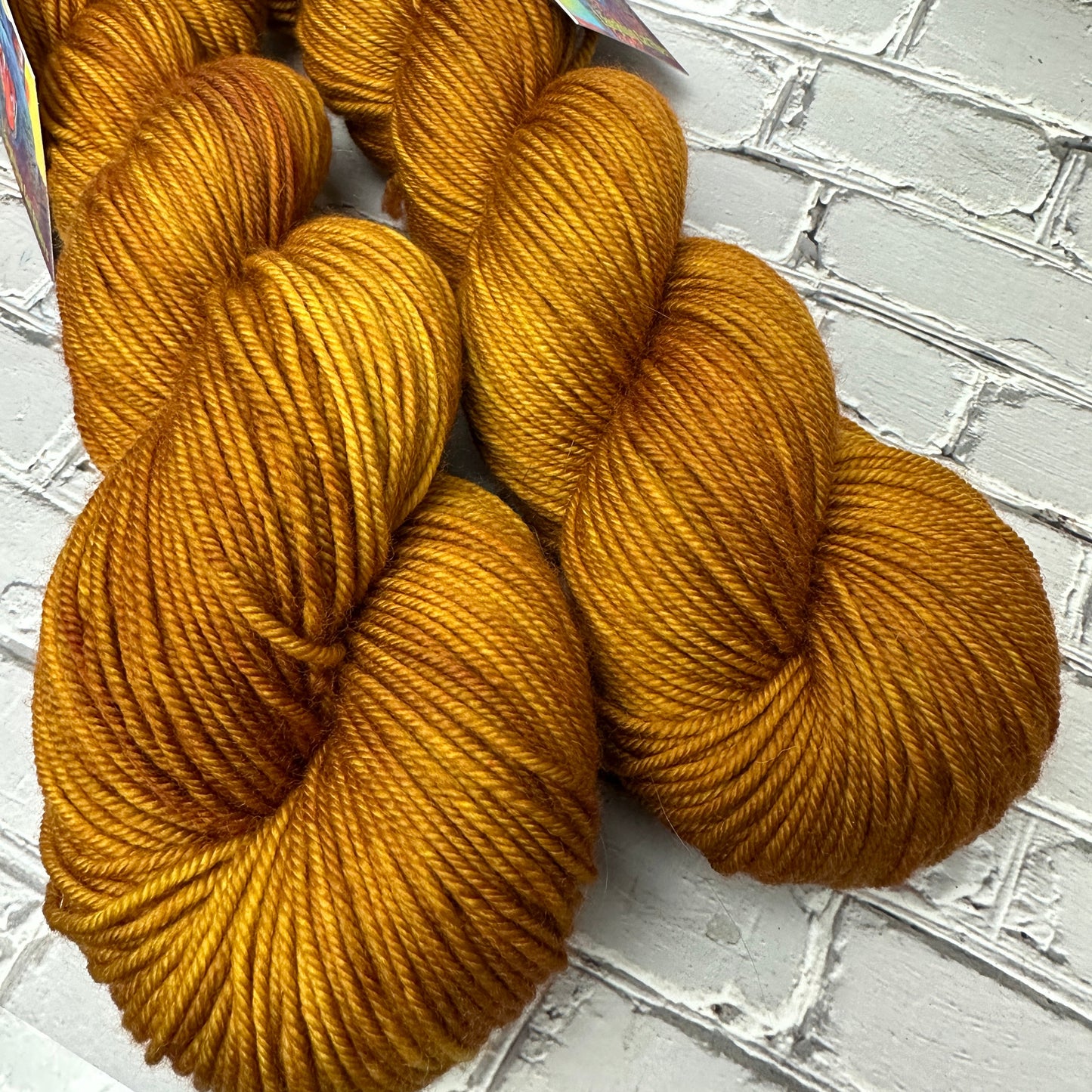half skeins dyed by laughing Cat fibers in their tobacco leaf colorway 